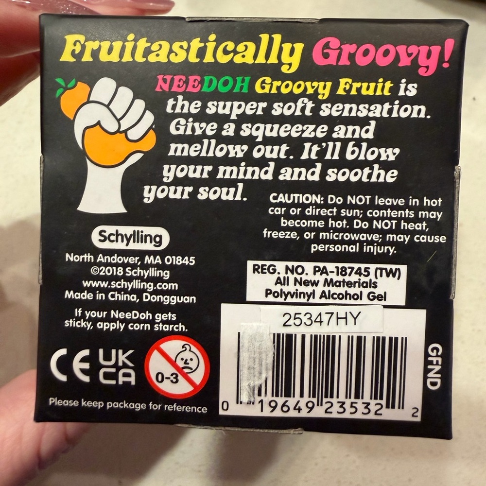 Schylling Groovy NeeDoh Orange Fruit Sensory Toy with Green Leaf - Picture 2 of 6